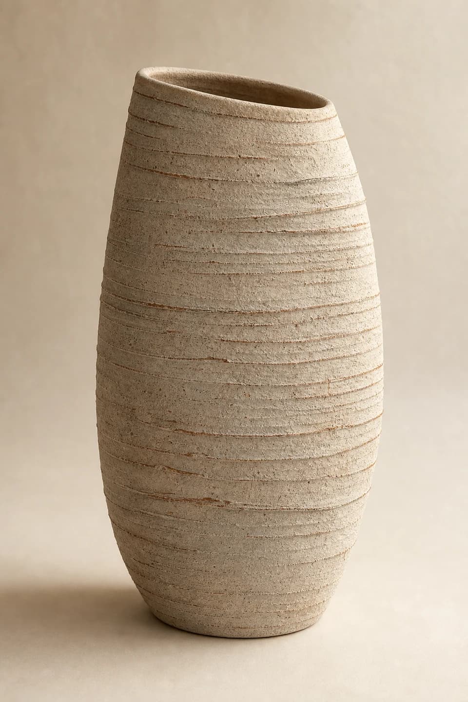 Tall hand-built stoneware vessel with horizontal ridges
